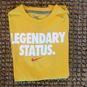 Nike Legendary Status gold T-SHIRT with red check